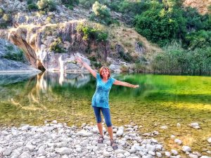 Jane Clements Life Coach standing in front of a green water pool