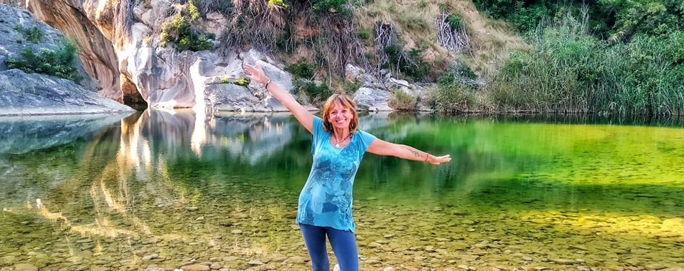 Jane Clements Life Coach standing in front of a green water pool